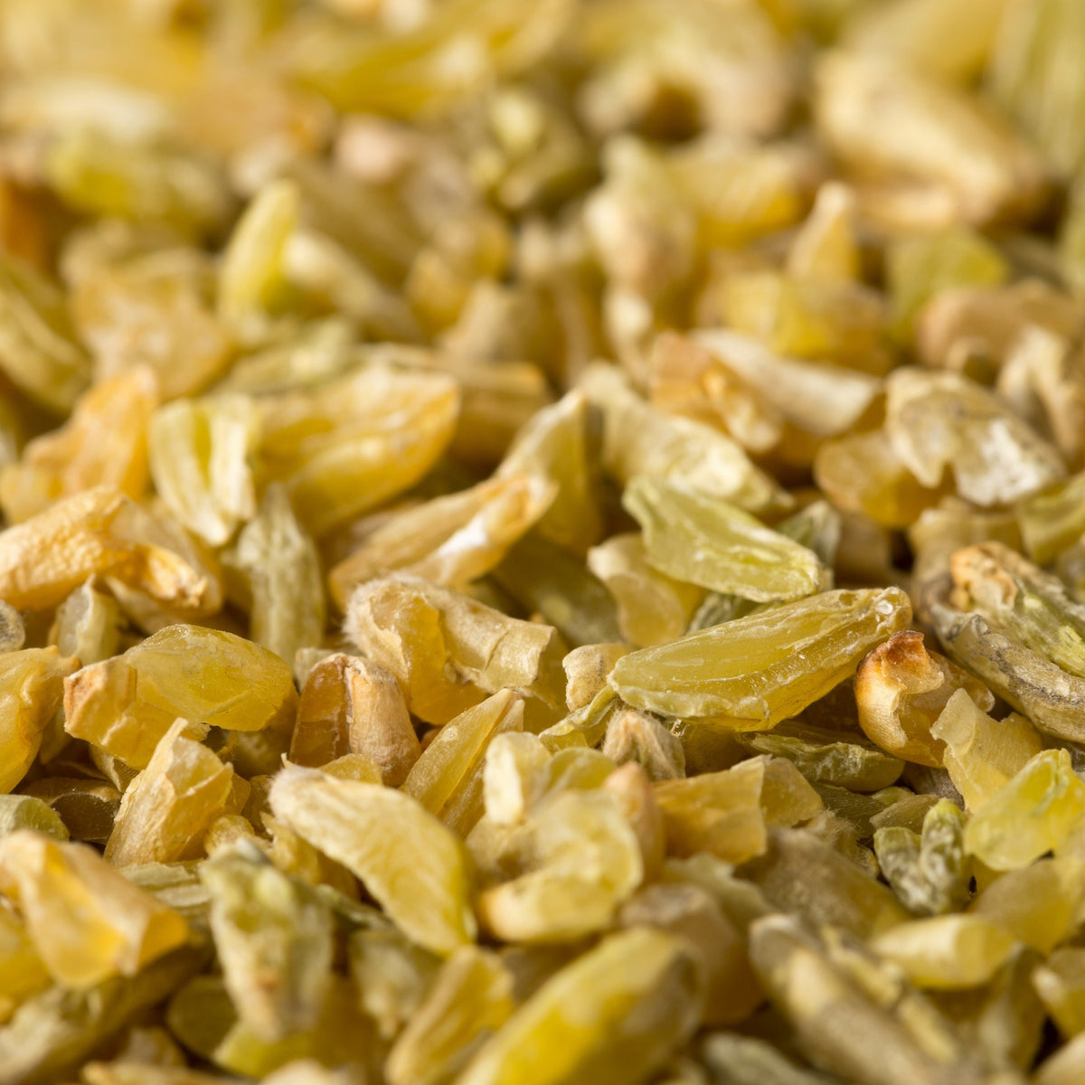 A close-up of Freekeh Cracked from The Herb Shed in Wollongong, Australia, showing the broken grain pieces and their naturally earthy green and golden colouring.