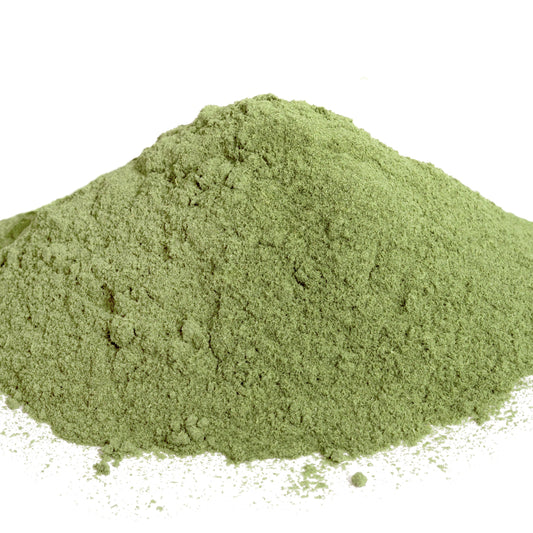 Close-up of a soft mound of pale green lemongrass powder on a clean white background – The Herb Shed Wollongong.
