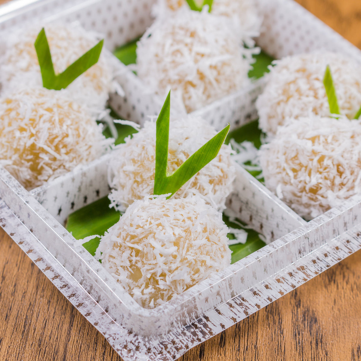 Coconut-covered dessert balls made with coconut flour, from The Herb Shed Wollongong Australia.