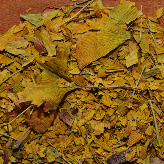 A close-up of Organic Ginkgo from The Herb Shed Wollongong, Australia, showing the cut dried leaves with their naturally varied yellow-green and brown colouring and leafy texture.