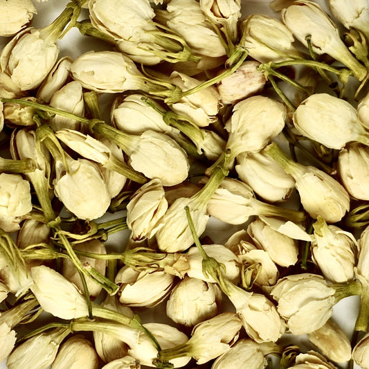 A close-up of Organic Jasmine Flower Buds from The Herb Shed Wollongong, Australia, showing the small dried buds with their naturally pale cream and soft green colouring.