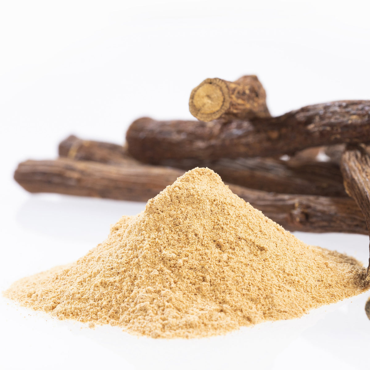 Organic Licorice Root Powder from The Herb Shed Wollongong, Australia, shown in a mound beside whole dried licorice roots, displaying the powder alongside the root it comes from.