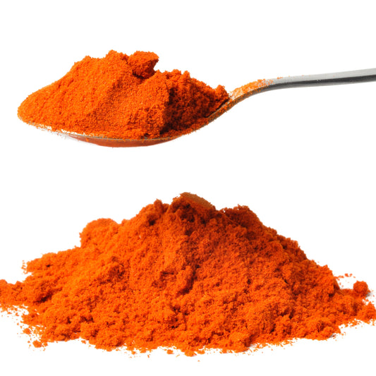 Spoonful of cayenne pepper powder on a white background – bold red heat from The Herb Shed Wollongong