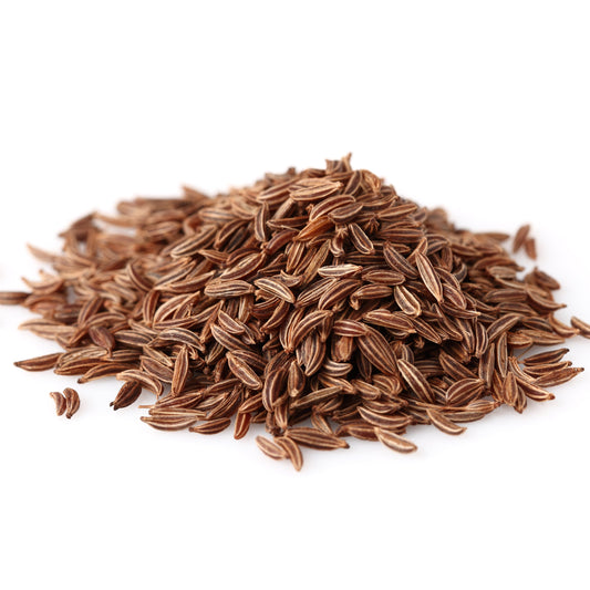 Close-up pile of fennel seeds on a clean white background.