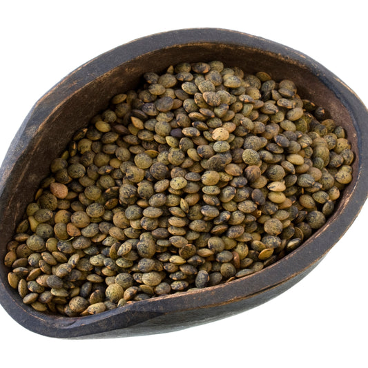 French style lentils in an oddly shaped wooden bowl on a white background – earthy green lentils from The Herb Shed Wollongong