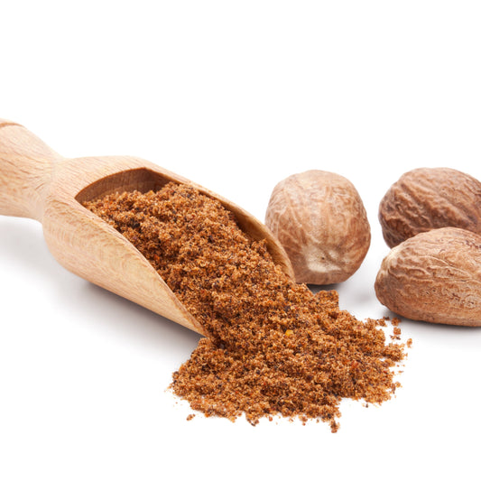 Ground nutmeg with whole nutmeg and wooden scoop from The Herb Shed Wollongong
