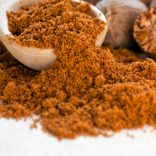 Organic ground nutmeg close-up with wooden scoop from The Herb Shed Wollongong
