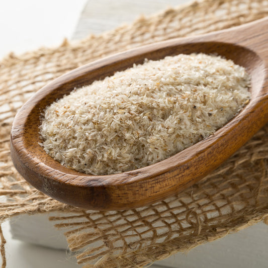 Psyllium husk in a wooden spoon on a hessian sack – fine digestive fibre from The Herb Shed Wollongong