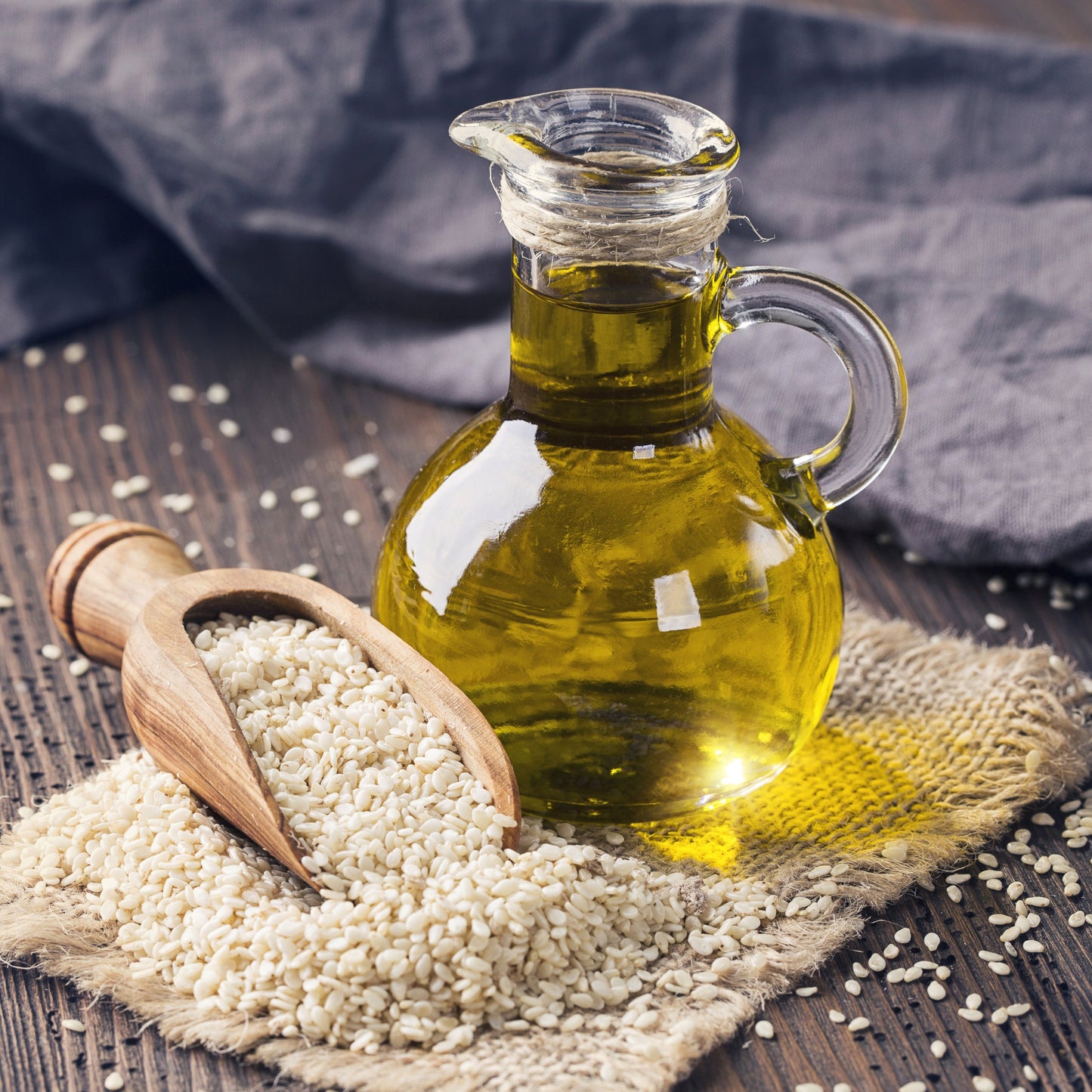 Sesame seeds with sesame oil bottle and scoop from The Herb Shed Wollongong