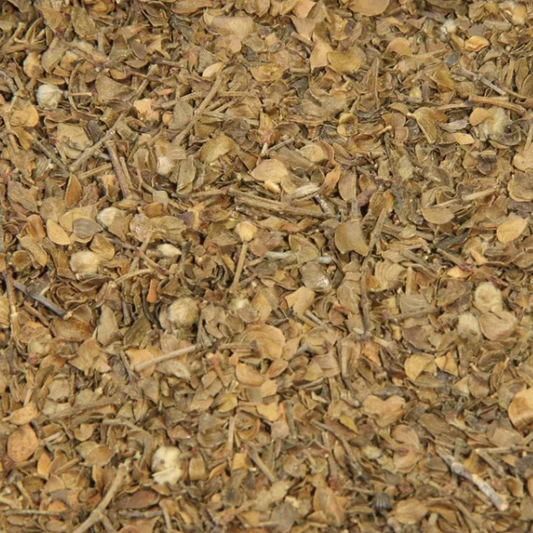 A close-up of dried Chaparral showing the chopped leaves, small stems and naturally varied green and brown colouring of the dried herb.