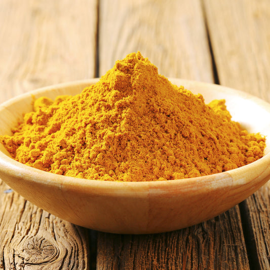 A close-up of Curry Powder Mild from The Herb Shed Wollongong, Australia, showing the finely ground spice blend with its warm golden-yellow colouring.