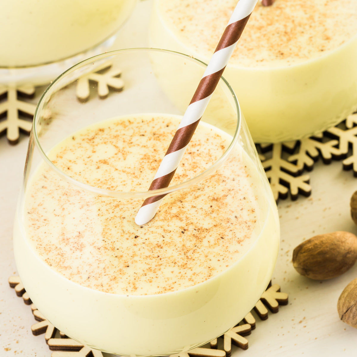 A creamy drink dusted with ground nutmeg, showing Ground Nutmeg from The Herb Shed in Wollongong, Australia, used to add warm spice to drinks.