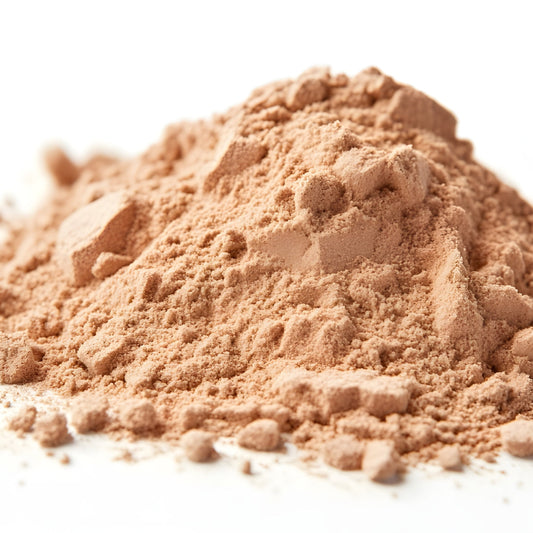 A close-up mound of Organic Arjuna Bark Powder against a white background, showing its finely ground texture and natural pale brown colouring.