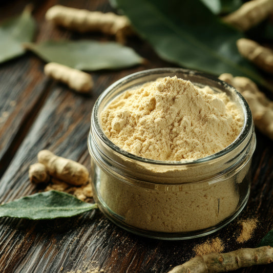 Organic Ashwagandha Powder fills a small glass jar on a rustic wooden surface, surrounded by loose powder, dried ashwagandha roots and leaves.