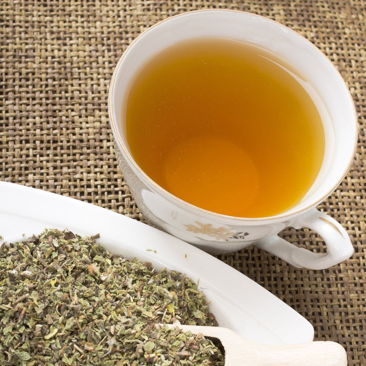 Brewed Organic Cistus Rock Rose tea beside loose dried leaves, from The Herb Shed Wollongong Australia.