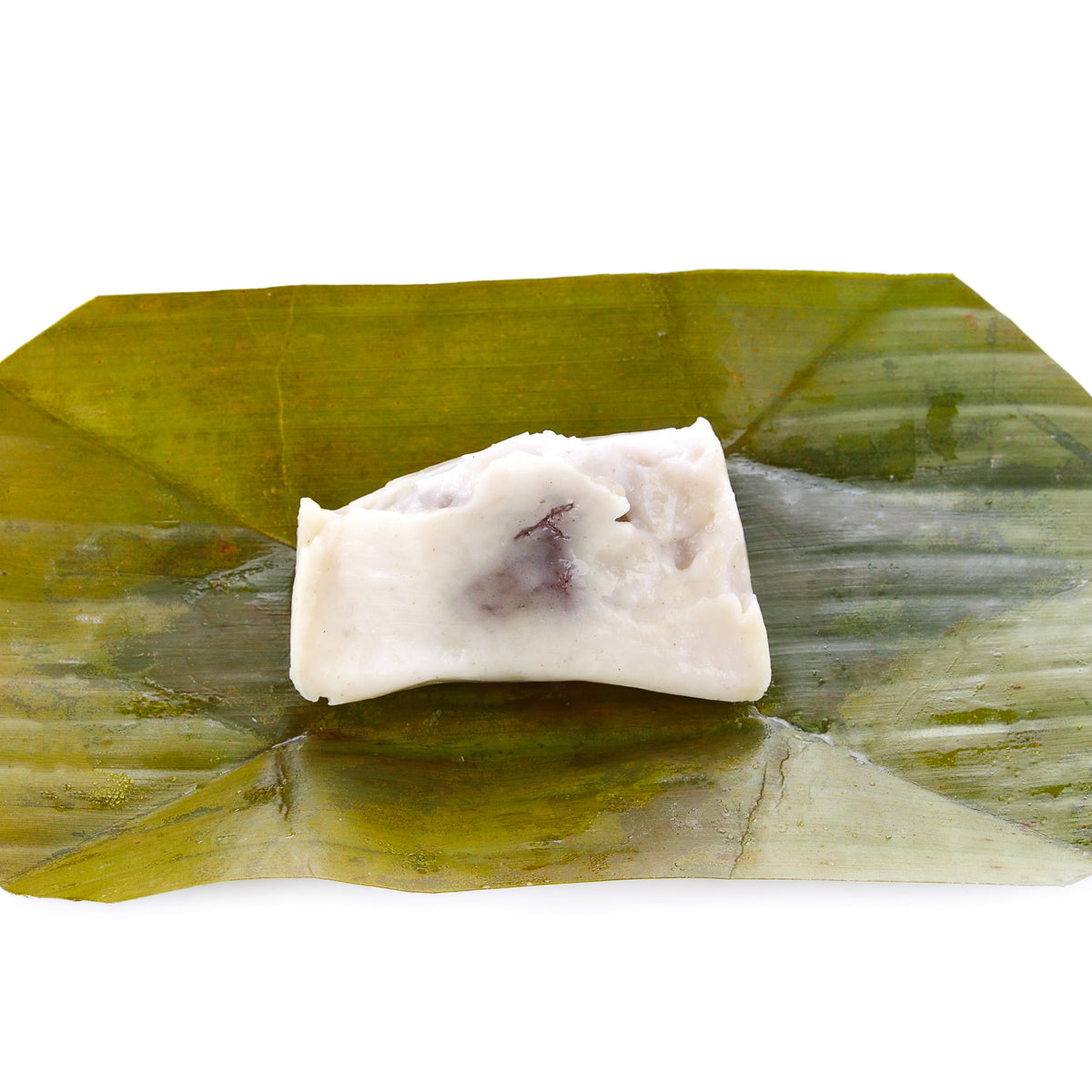 Coconut sweet made with coconut flour and wrapped in a green leaf, from The Herb Shed Wollongong Australia.