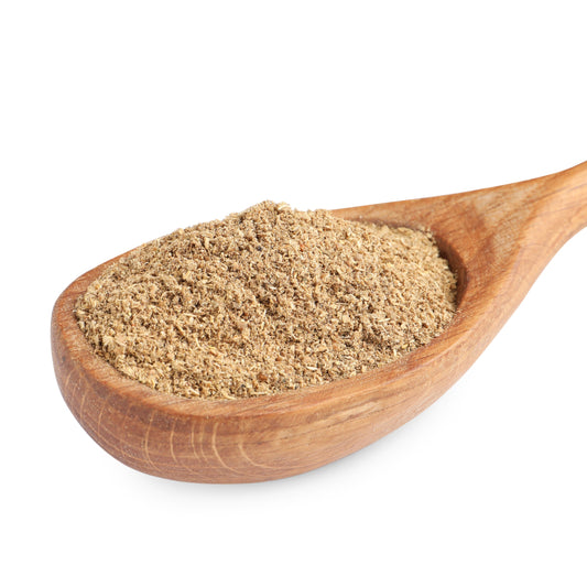 Organic Ground Coriander Seed fills a wooden scoop against a white background, showing the finely ground texture and natural warm beige colouring of the spice.