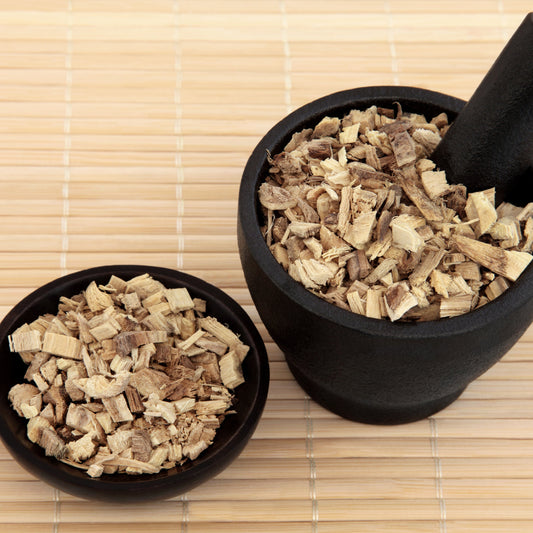 Organic Licorice Root Tea from The Herb Shed Wollongong, Australia, shown as small pieces of cut dried licorice root in black bowls, displaying the naturally varied cream and brown colouring and woody texture.