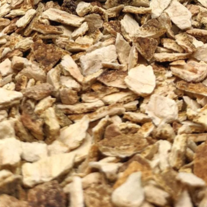 A close-up of Orange Peel Sweet Dried Pieces showing their coarse, irregular texture and natural cream, tan and brown colouring.