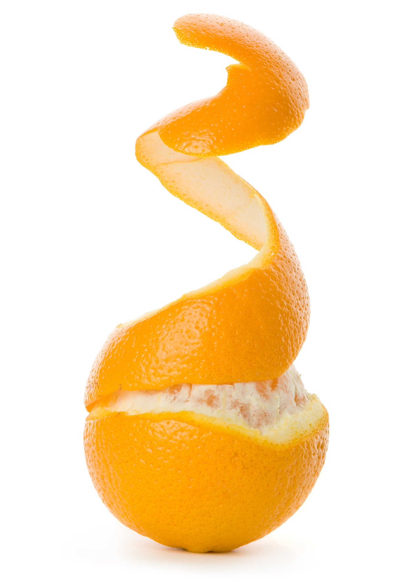 A fresh orange with a long spiral of orange peel curling upwards against a clean white background.