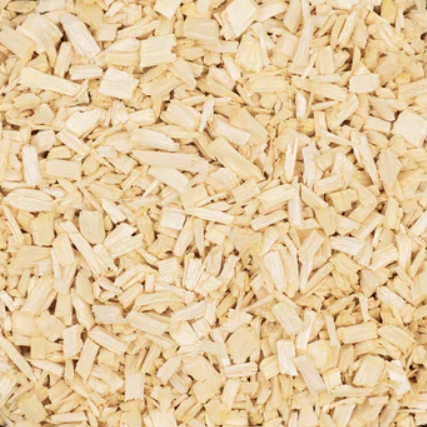A close-up of Quassia Chips showing the small, pale cream and light brown pieces of dried quassia wood.