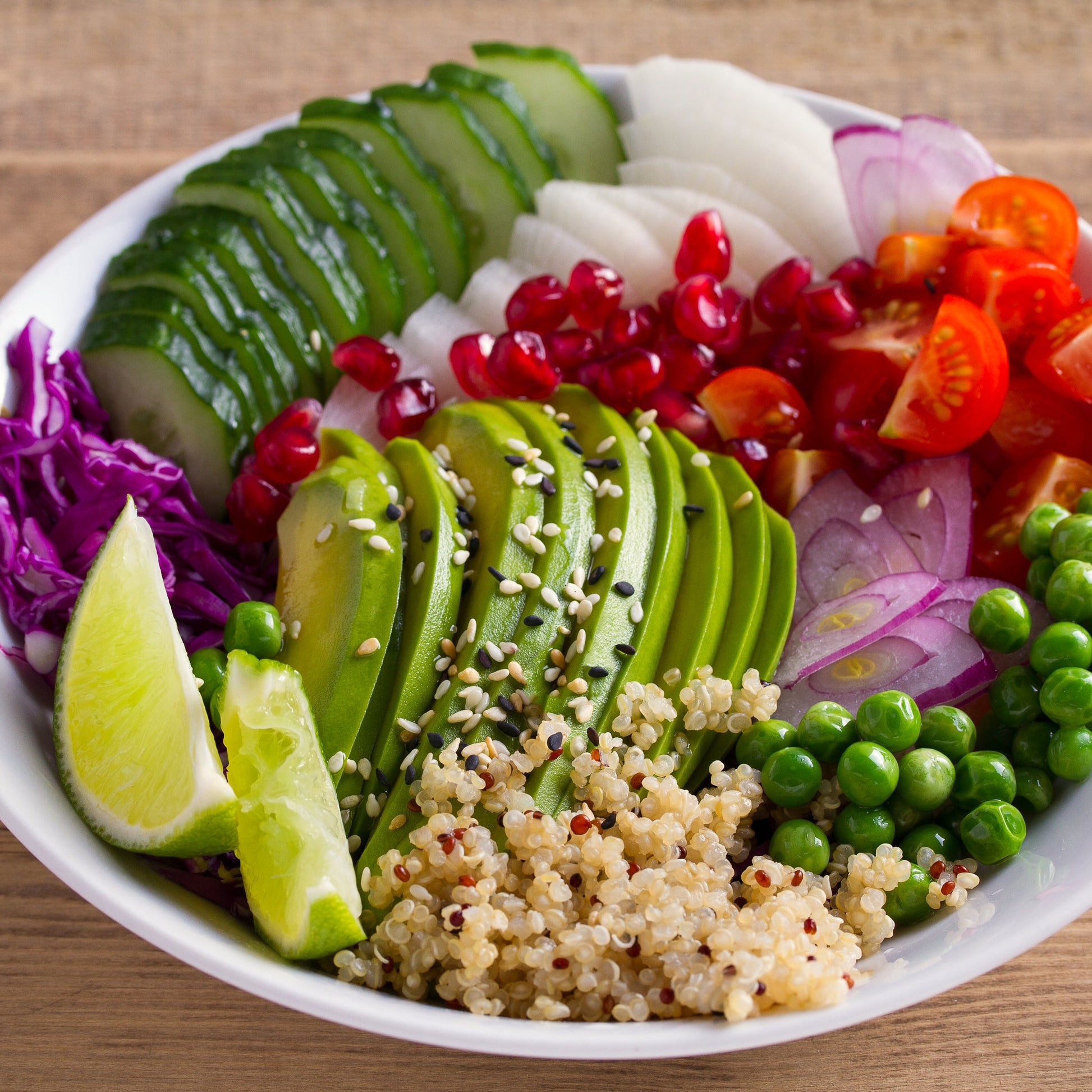 Organic white quinoa salad with fresh vegetables and lime