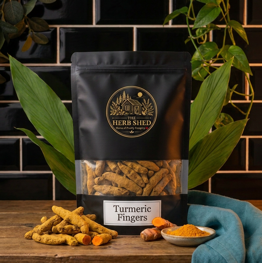 A black stand-up pouch of The Herb Shed Turmeric Fingers displayed with turmeric in a kitchen setting, Wollongong Australia.