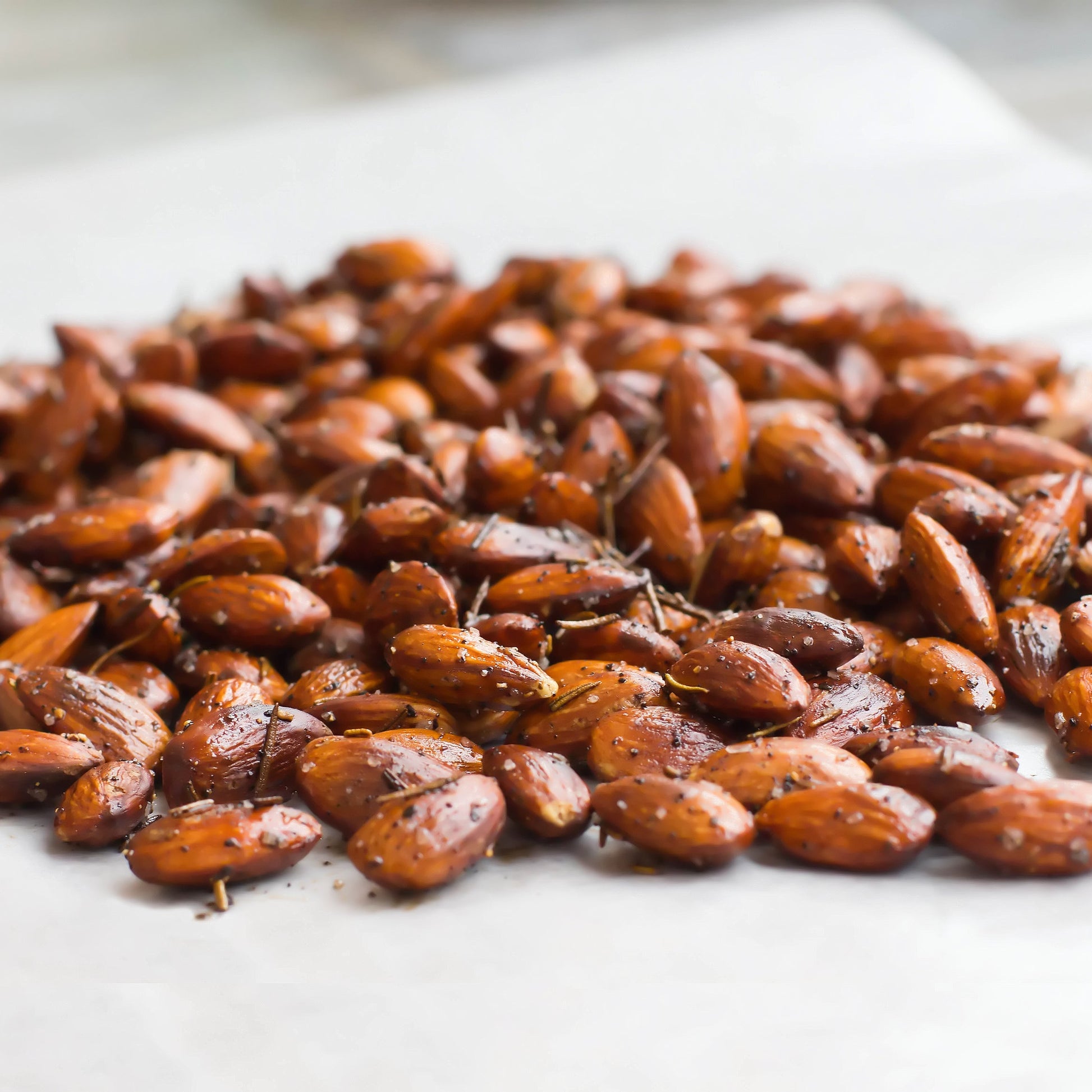 Roasted almonds seasoned with kosher salt, rosemary and spices