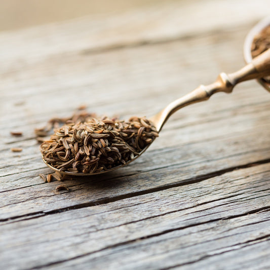 Organic caraway seeds on wooden spoon from The Herb Shed Wollongong
