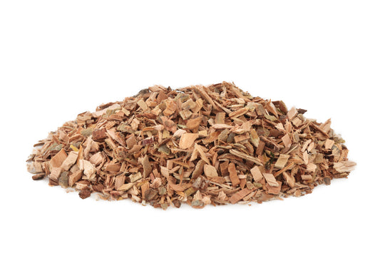 Close-up pile of white willow bark on a white background – earthy herbal tea bark from The Herb Shed Wollongong