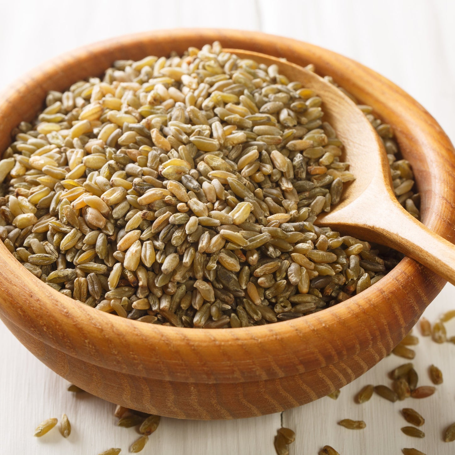 Whole freekeh grain in wooden bowl
