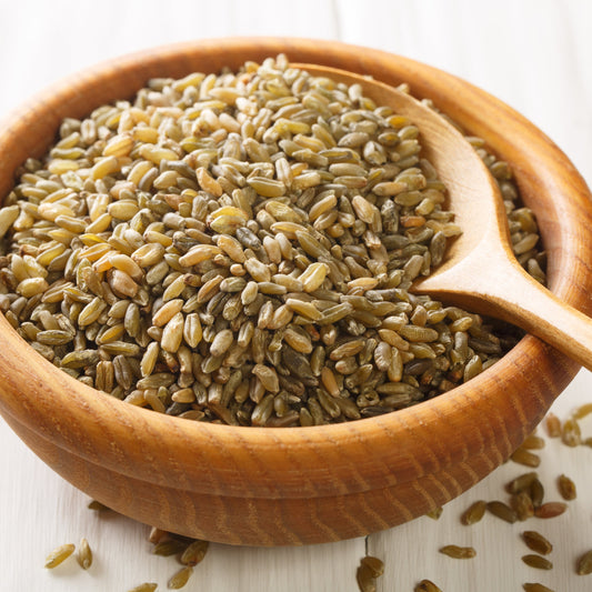 Whole freekeh grain in wooden bowl