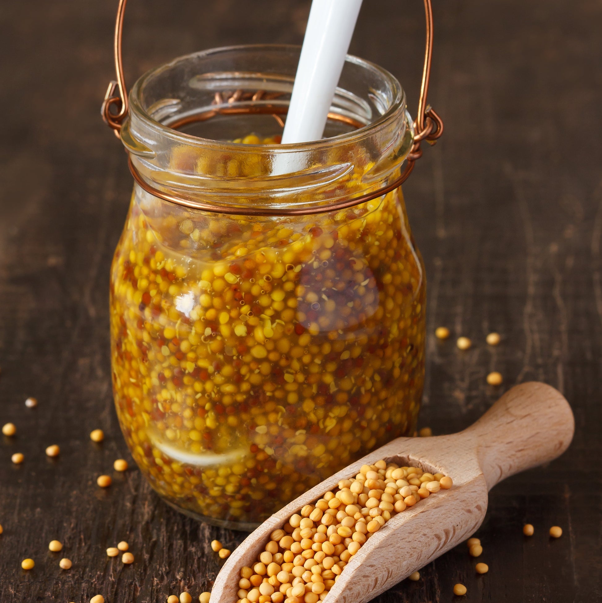 Wholegrain mustard made with Organic Yellow Mustard Seeds in a glass jar.